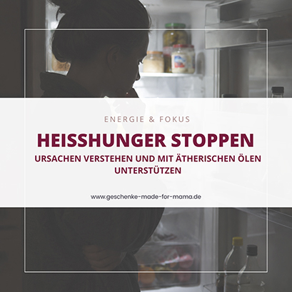 Frau mit Heißhunger nachts vor geöffnetem Kühlschrank – ätherische Öle können unterstützen